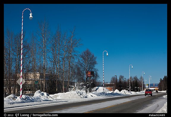 Main street and white street lights with red stripes. North Pole, Alaska, USA (color)