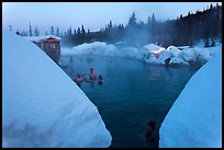 Soaking in natural hot pool surrounded by snow. Chena Hot Springs, Alaska, USA (color)