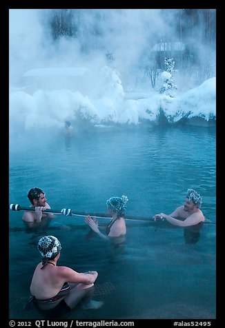 People with frozen hair relaxing in hot springs. Chena Hot Springs, Alaska, USA