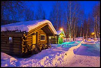 Path in snow and cabins at night. Chena Hot Springs, Alaska, USA (color)