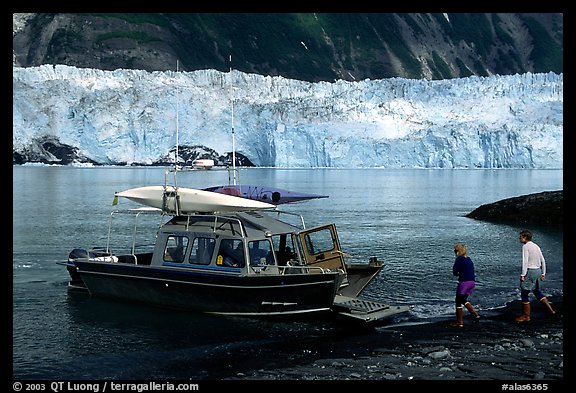Water taxi boats lands on Black Sand Beach. Prince William Sound, Alaska, USA