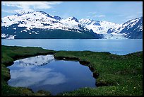 Pond, mountains, and glaciers across Harriman Fjord. Prince William Sound, Alaska, USA
