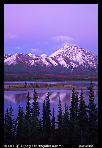 Snowy peaks and lake at dusk. Alaska, USA