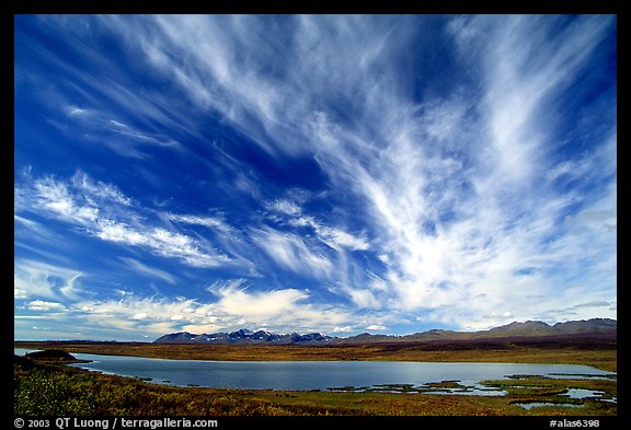 Clouds, tundra and lake along Denali Highway. Alaska, USA (color)