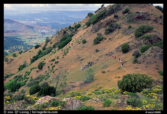 Group of Hikers on a distant trail, Mt Diablo State Park. California, USA (color)