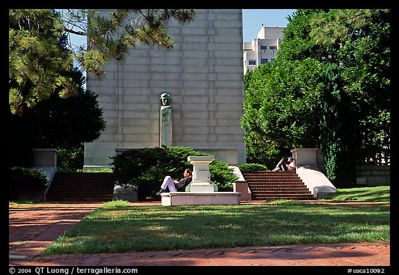 Reading at the base of the Campanile on the UC Campus. Berkeley, California, USA (color)