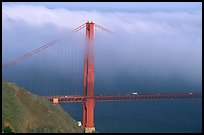 Golden Gate bridge with top covered by fog. San Francisco, California, USA (color)