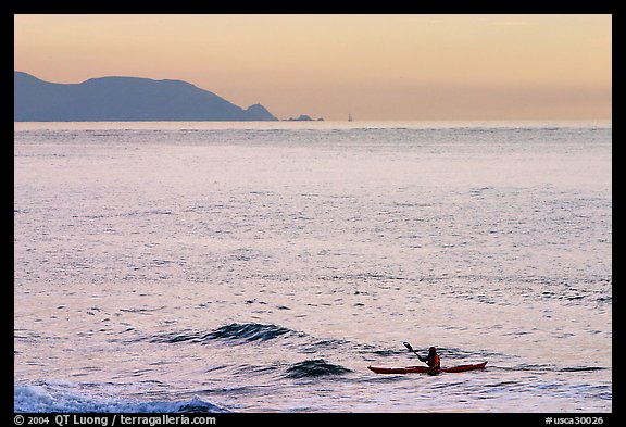 Sea kayaker, Rodeo Beach, sunset. California, USA