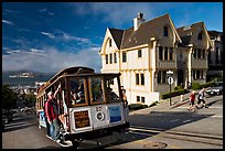 Cable car climbing, and Tudor house, late afternoon. San Francisco, California, USA (color)