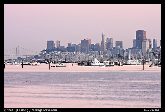 Alcatraz Island and Bay Bridge, painted in pink hues at sunset. San Francisco, California, USA (color)
