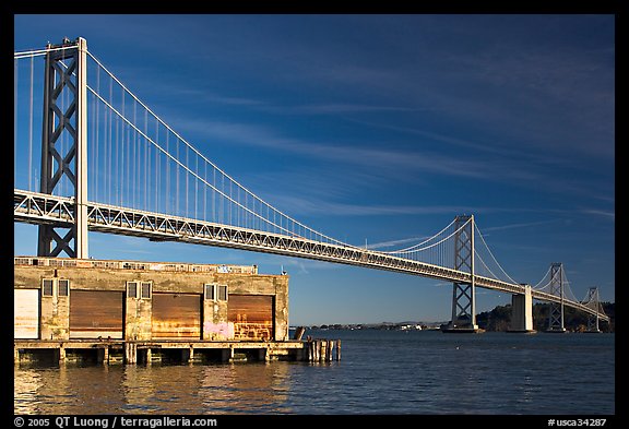 Old pier and Bay Bridge, early morning. San Francisco, California, USA (color)