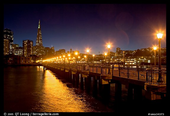 Skyline, Pier 7 lights and reflections at night. San Francisco, California, USA (color)