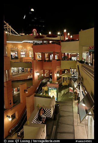 Some of the 140 stores in the Horton Plaza shopping mall at night. San Diego, California, USA (color)