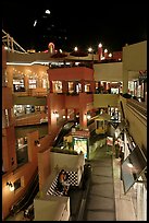 Some of the 140 stores in the Horton Plaza shopping mall at night. San Diego, California, USA (color)