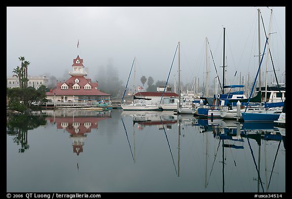 Boats and historic Coronado boathouse in fog. San Diego, California, USA