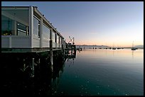 Waterfront restaurant in Morro Bay harbor, sunset. Morro Bay, USA
