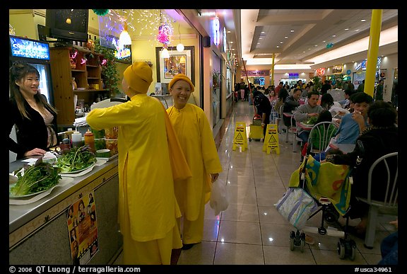 Buddhist nuns in the foot court of the Grand Century mall. San Jose, California, USA