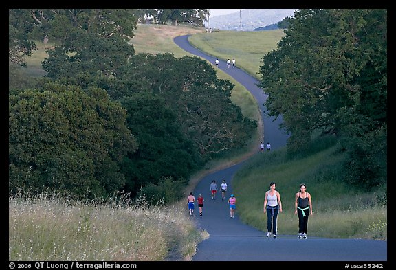 Women walking on trail, Stanford academic preserve. Stanford University, California, USA (color)