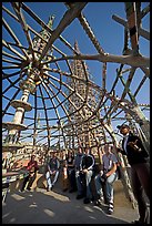 Tour guide and group in the Gazebo of the Watts Towers. Watts, Los Angeles, California, USA