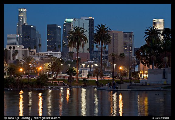 Skyline and lights reflected in a lake in Mc Arthur Park. Los Angeles, California, USA