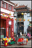 Rides and buildings in Chinese style, Chinatown. Los Angeles, California, USA (color)