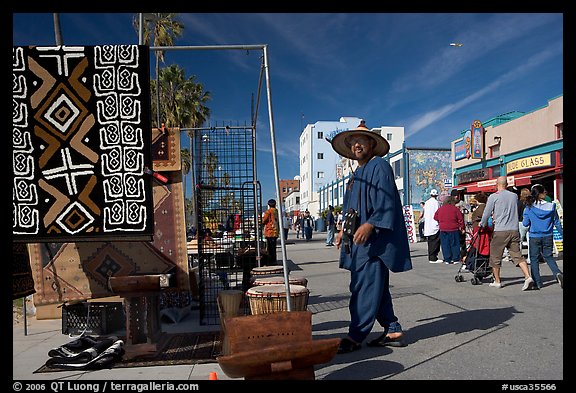 Man selling crafts on Venice Boardwalk. Venice, Los Angeles, California, USA (color)