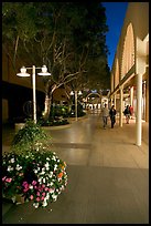 Couple walking by stores and flowers, Stanford Shopping Center. Stanford University, California, USA ( color)