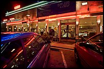 Cars and neon light of dinner at night. San Francisco, California, USA (color)