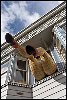 Giant legs with stockings hanging from a second floor, Haight-Ashbury District. San Francisco, California, USA