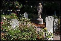 Gravestones and statue, Mission Dolores. San Francisco, California, USA (color)
