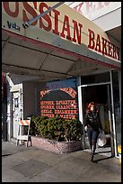 Russian Bakery with redhead woman walking out. San Francisco, California, USA (color)