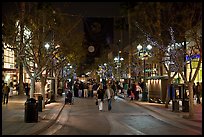 Couple walking on pedestrian Third Street by night. Santa Monica, Los Angeles, California, USA