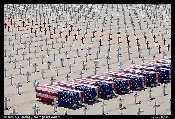 Flag draped coffins and crosses, Santa Monica beach. Santa Monica, Los Angeles, California, USA