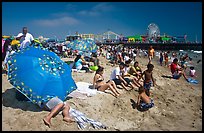 Beach unbrellas and Santa Monica Pier. Santa Monica, Los Angeles, California, USA