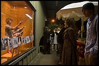 People watch performance artists in window, Bergamot Station. Santa Monica, Los Angeles, California, USA ( color)