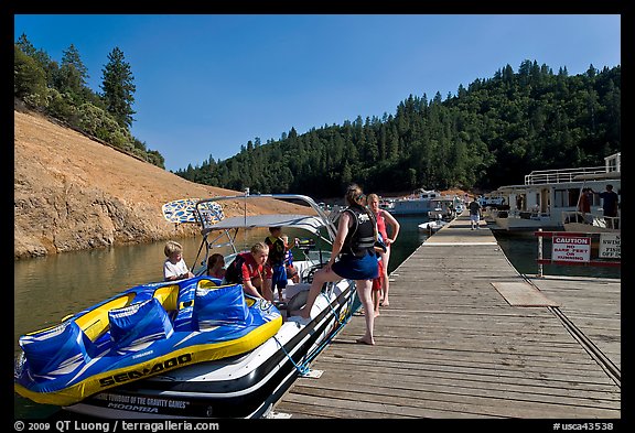 Deck with family preparing a boat, Shasta Lake. California, USA