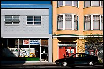 Street with brighly painted buildings, Mission District. San Francisco, California, USA (color)