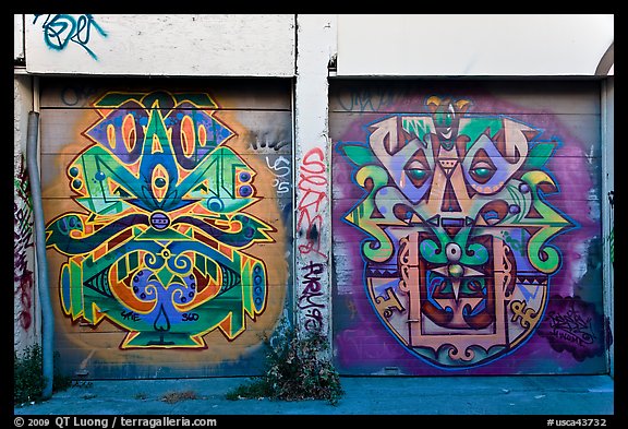 Two painted garage doors, Mission District. San Francisco, California, USA