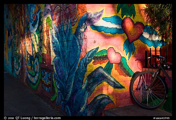 Bicycle and last light on mural, Mission District. San Francisco, California, USA (color)