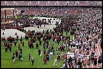 Audience and graduates mingling in stadium after commencement. Stanford University, California, USA ( color)