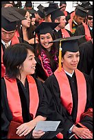 Students in academical dress sitting during graduation ceremony. Stanford University, California, USA