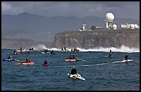 Flottila of personal watercraft near Mavericks break in front of  Pillar Point air force station. Half Moon Bay, California, USA