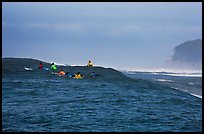 Surfers waiting for wave at Mavericks. Half Moon Bay, California, USA