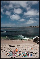 People sunning themselves on beach. Pacific Grove, California, USA (color)