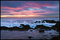 Wave crashing on rock at sunset. Point Lobos State Preserve, California, USA