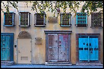 Wall with weathered doors and windows. Santana Row, San Jose, California, USA