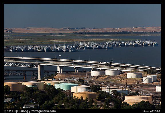 Oil tanks, Carquinez Strait, and mothball fleet. Martinez, California, USA