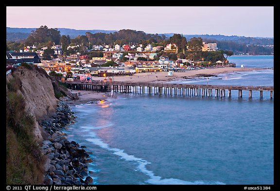 Cliff, Fishing Pier at sunset, and village. Capitola, California, USA (color)