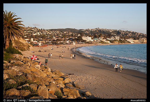 Beach with people strolling in late afternoon. Laguna Beach, Orange County, California, USA (color)
