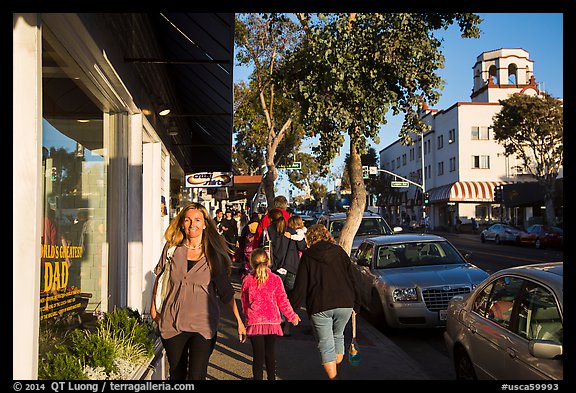 Visitors walk on sidewalk in shopping area. Laguna Beach, Orange County, California, USA (color)